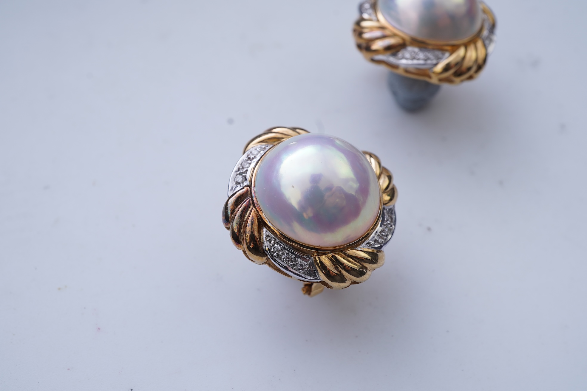 A pair of mabé cultured pearl and diamond earrings